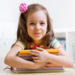 39297096 – cute child girl preschooler with books indoor