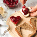 27775809 – woman cooking a sweet breakfast – bread with jam
