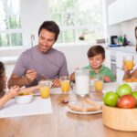 18122552 – family eating healthy breakfast in kitchen
